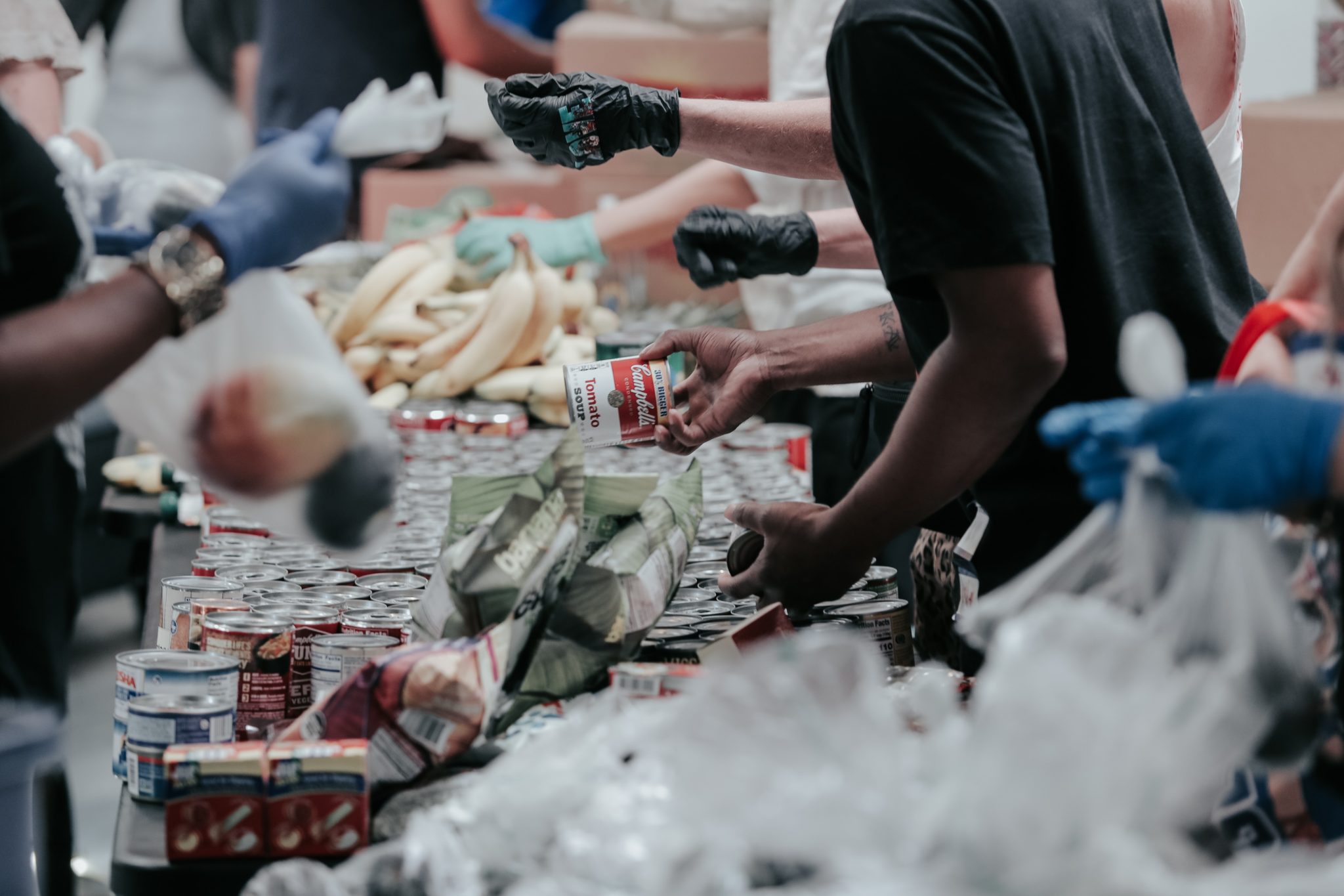 People at a food pantry in California share items in September 2020.